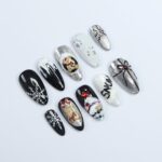 Elevate Your Holiday Style with Medium Almond Press-On Nails: Sleek Black Design Adorned with White Snowflakes - Perfect Christmas Gift - Image 2