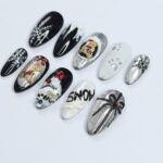 Elevate Your Holiday Style with Medium Almond Press-On Nails: Sleek Black Design Adorned with White Snowflakes - Perfect Christmas Gift - Image 4