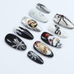 Elevate Your Holiday Style with Medium Almond Press-On Nails: Sleek Black Design Adorned with White Snowflakes - Perfect Christmas Gift - Image 3