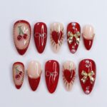 Chic Dark Red Press-On Nails: Adorned with Gold Bows, Charming Cherries & Sparkling Gems – Perfect Holiday Glam or Thoughtful Gift for Her