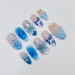 Press On Nails Blue Lagoon with Shell & Floral Art | Oceanic 3D Fake Nails in Medium Almond | Handmade Summer Nail Art for Holiday, Vacation - Image 4