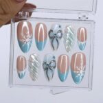 Winter Press On Nails with Snowflake & Silver Bow Design | Fake Nails in Medium Almond | Handmade Nail Art for Christmas Or Holiday Season - Image 5