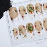 Christmas Press On Nails with White French Tips & Christmas Tree Design | Nude Medium Almond Fake Nails | Handmade Holiday Nail Art - Image 2