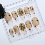 Christmas Press On Nails with White French Tips & Christmas Tree Design | Nude Medium Almond Fake Nails | Handmade Holiday Nail Art - Image 5