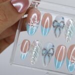 Winter Press On Nails with Snowflake & Silver Bow Design | Fake Nails in Medium Almond | Handmade Nail Art for Christmas Or Holiday Season - Image 2