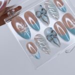 Winter Press On Nails with Snowflake & Silver Bow Design | Fake Nails in Medium Almond | Handmade Nail Art for Christmas Or Holiday Season - Image 4
