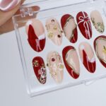 Christmas Press On Nails with Red & Gold Design | Fake Nails in Medium Almond | Handmade Nail Art For Holiday, Birthday Or Gift For Her - Image 2