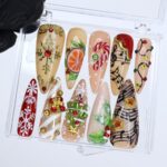 Christmas Press On Nails with Snowflakes, Candy Cane, Music Notes | 3D Fake Nails in Long Almond | Handmade Nail Art For Holiday Or Gifts