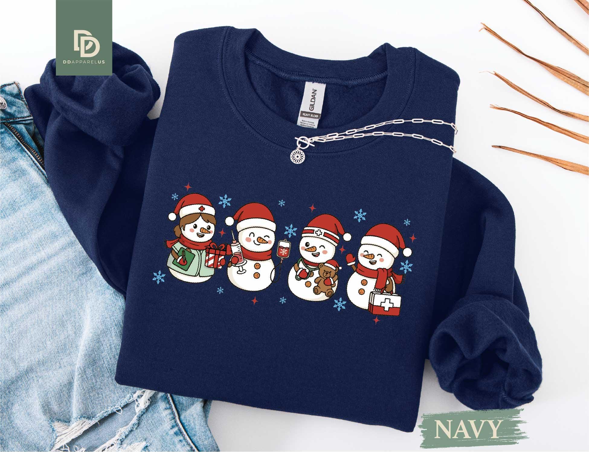 il_fullxfull.7423302641_pxv5.jpg Christmas Nurse Shirt Sweatshirt, Cute Holiday Nurse Tee, ICU RN Gift for Nurse, Snowman Nurse Shirt, Winter Medical Crew Hospital Party Tee - Image 1
