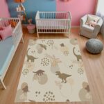 A soft, neutral-colored dinosaur area rug. A cute prehistoric animal pattern carpet, perfect for decorating nursery playrooms or toddler bedrooms.