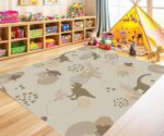 A soft, neutral-colored dinosaur area rug. A cute prehistoric animal pattern carpet, perfect for decorating nursery playrooms or toddler bedrooms. - Image 2