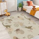 A soft, neutral-colored dinosaur area rug. A cute prehistoric animal pattern carpet, perfect for decorating nursery playrooms or toddler bedrooms. - Image 6