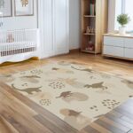 A soft, neutral-colored dinosaur area rug. A cute prehistoric animal pattern carpet, perfect for decorating nursery playrooms or toddler bedrooms. - Image 5