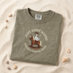 Embroidered Just Ridin’ Along Goose Shirt Comfort Colors Tee – Funny Cowboy Goose Graphic Shirt, Vintage Western Farm Animal Tee, Sarcastic Country Meme Shirt, Unhinged Funny Gift for Cowgirl Her Him